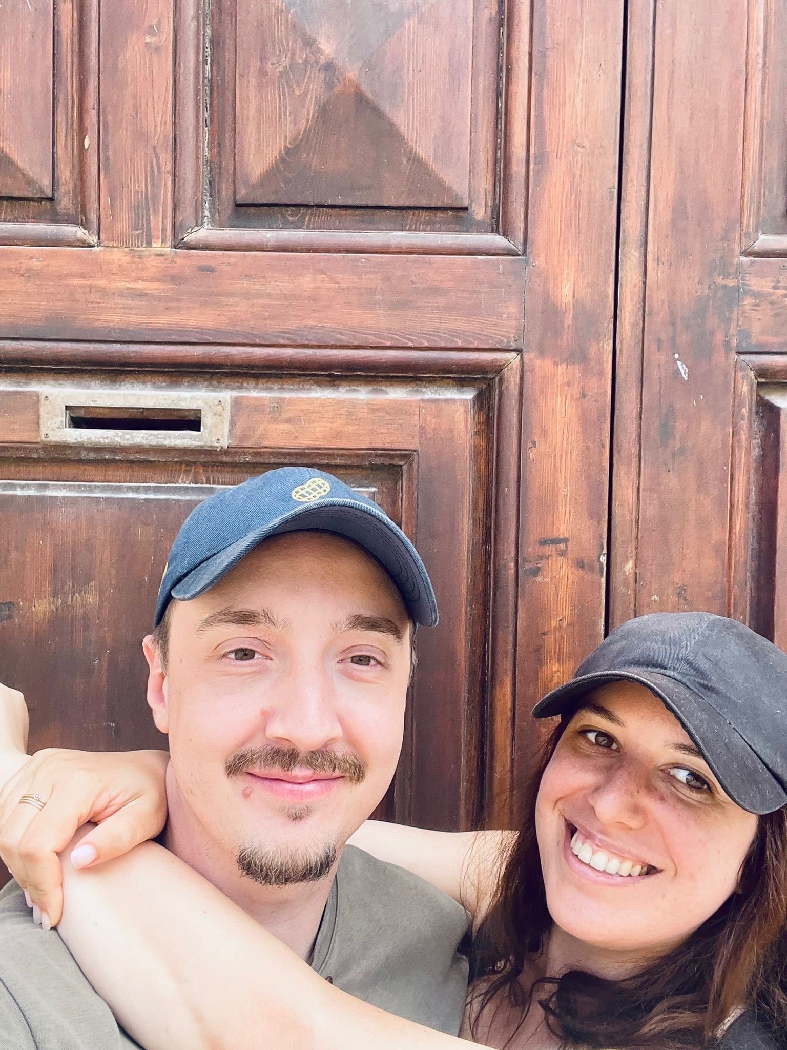 Couple selfie by wooden door